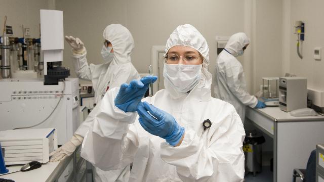 lab workers wearing PPE